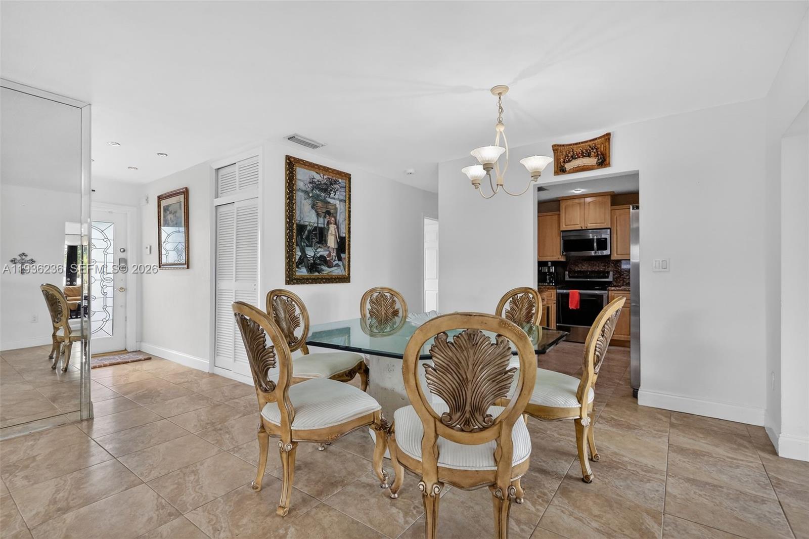 17841 Northwest 84th Court Hialeah, FL 33015 - Photo 9 of 76 a dining room with furniture and window