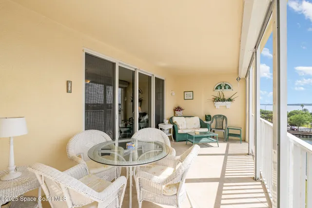 a view of swimming pool with a yard and large trees
