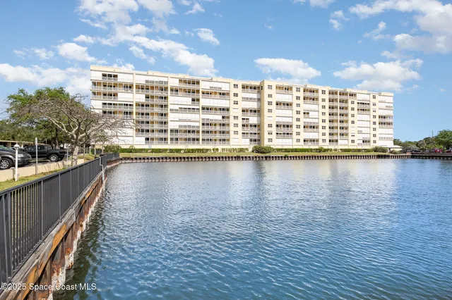 a view of a house with swimming pool and sitting area