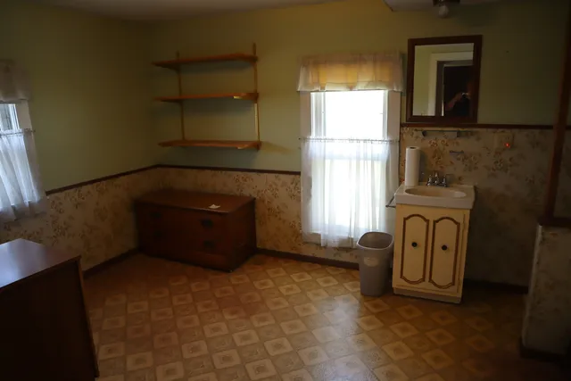 a room with a window and a couch