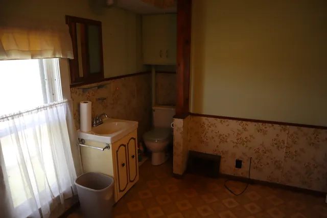 a bathroom with a toilet and a sink
