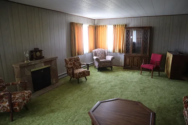 a living room with furniture and a fireplace