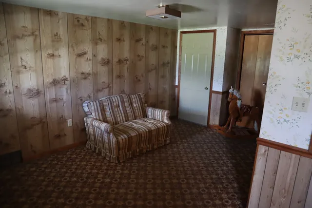 a living room with furniture and a shower