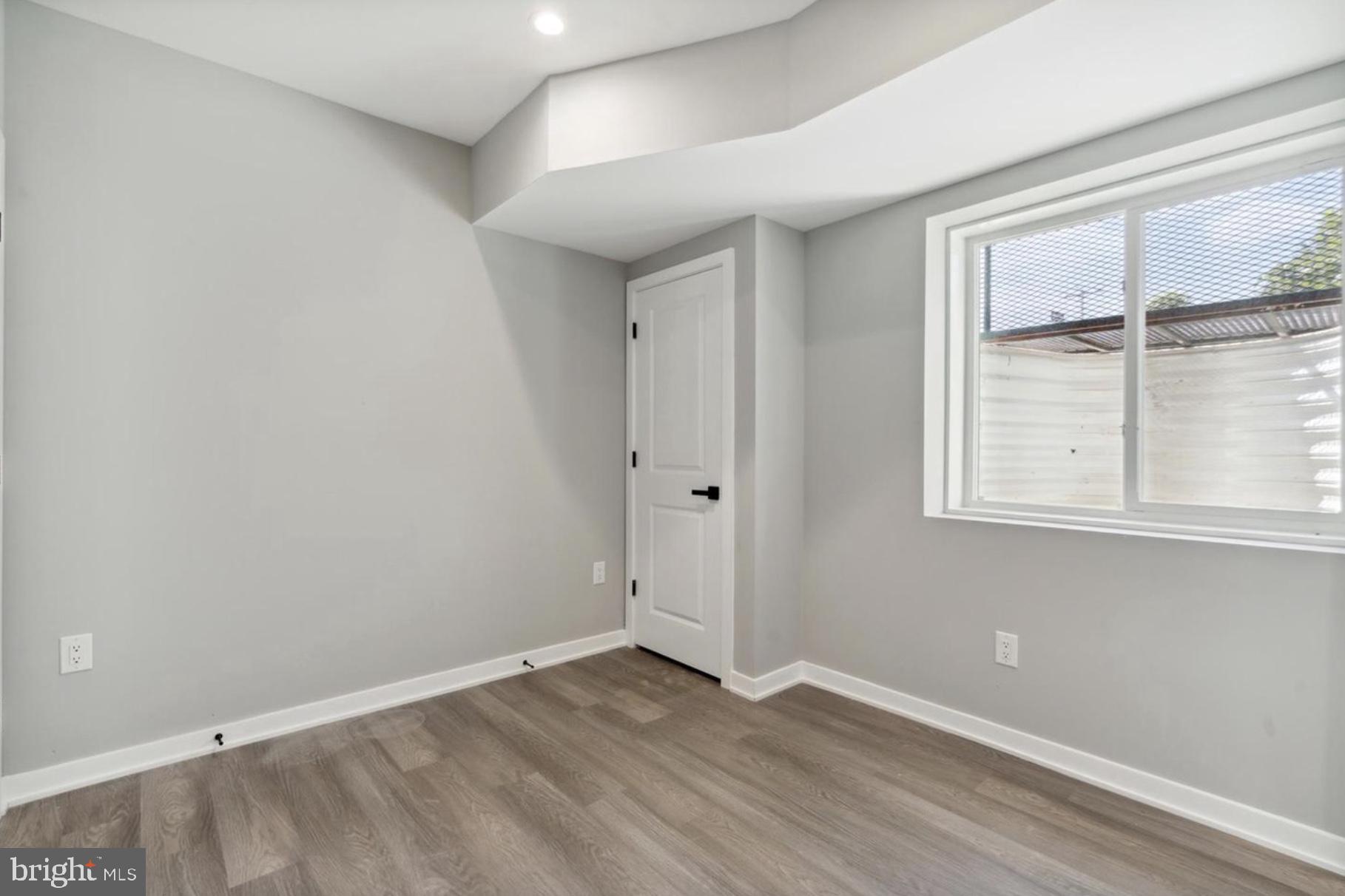2000 North 3rd Street, Unit 1 Philadelphia, PA 19122 - Photo 4 of 10 wooden floor in an empty room with a window