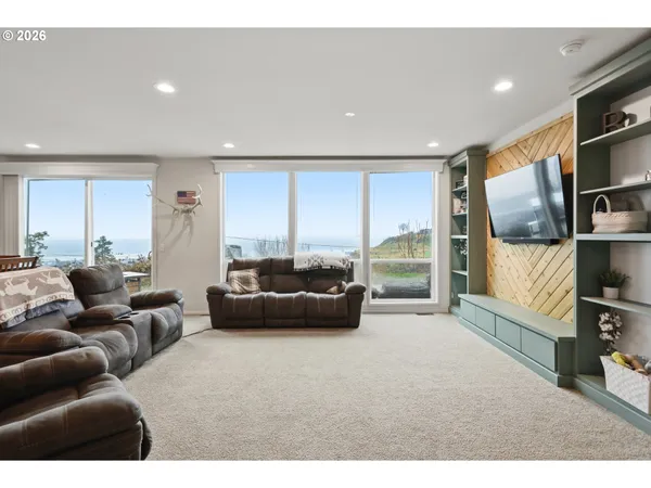 a living room with furniture and a large window
