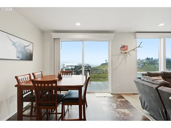 a view of a livingroom with furniture window and wooden floor