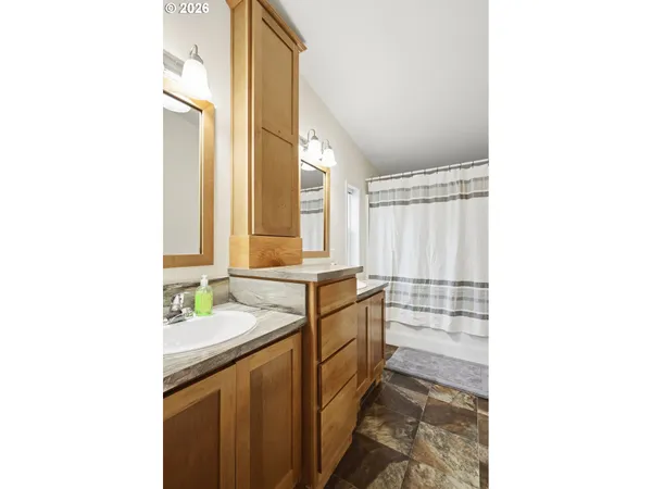 a room with a wooden floor and furniture