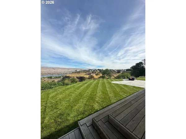 a view of a lake with a yard