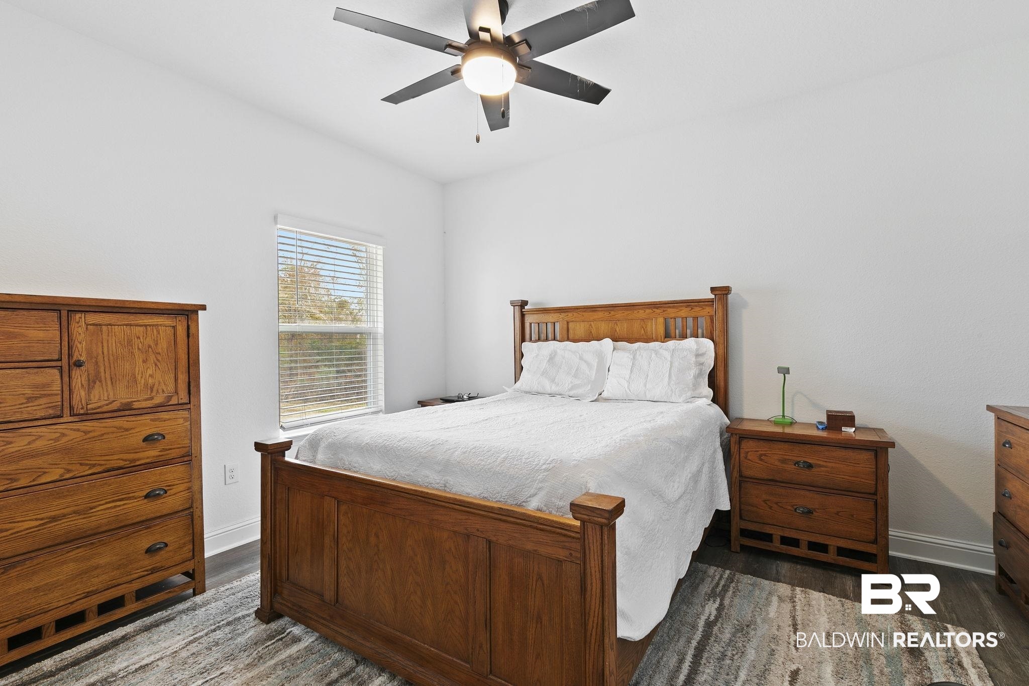 1141 Pencarro Boulevard Foley, AL 36535 - Photo 39 of 70 Bedroom with dark wood-type flooring and ceiling fan