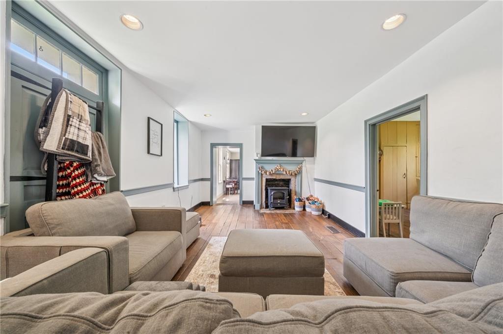 107 Hatfield Street Jefferson, PA 15344 - Photo 15 of 35 a living room with furniture fireplace and a flat screen tv