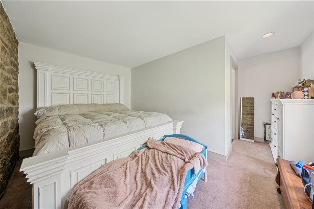 107 Hatfield Street Jefferson, PA 15344 - Photo 30 of 35 a bedroom with a bed and a refrigerator