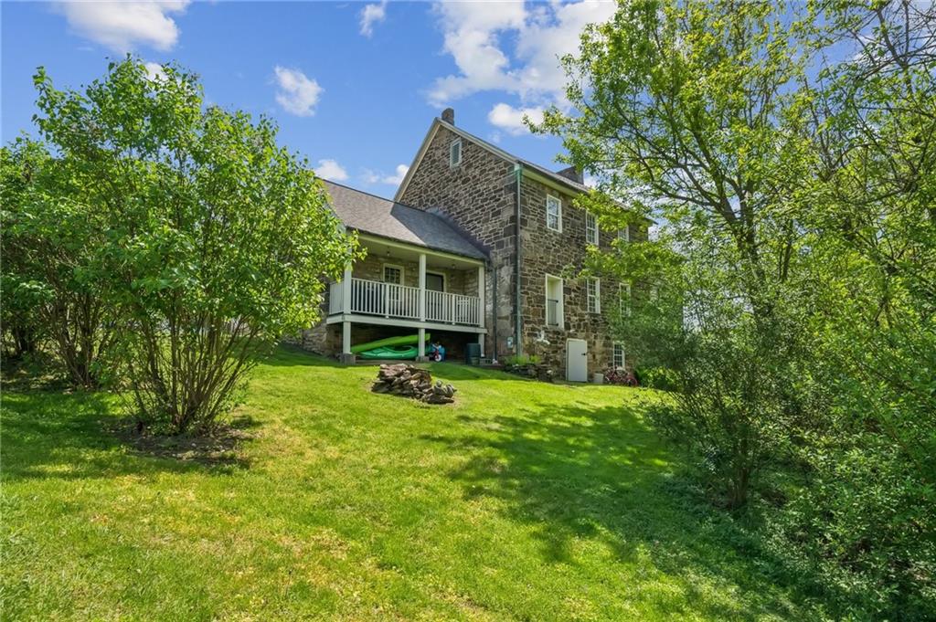 107 Hatfield Street Jefferson, PA 15344 - Photo 4 of 35 a view of a house with a backyard and a tree