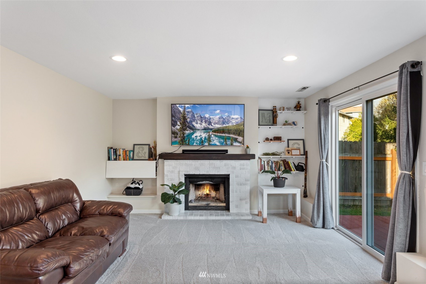 4805 Northeast 21st Street Renton, WA 98059 - Photo 11 of 40 a living room with furniture and a fireplace