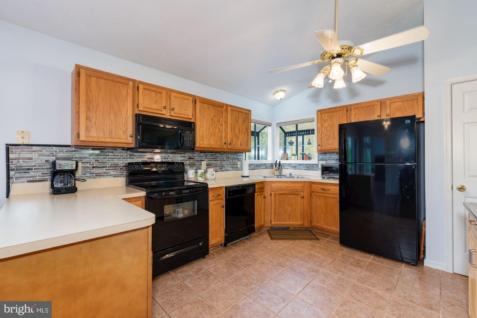 781 River Vw Road Rileyville, VA 22650 - Photo 5 of 16 a kitchen with stainless steel appliances granite countertop a refrigerator stove top oven a sink and dishwasher