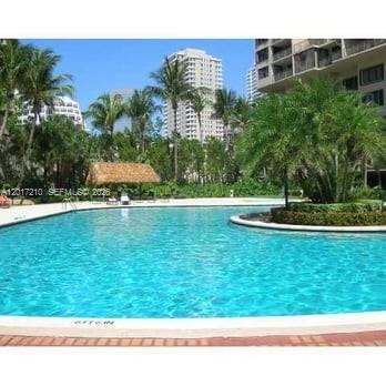 540 Brickell Key Drive, Unit 218 Miami, FL 33131 - Photo 12 of 12 a view of a green yard with large trees