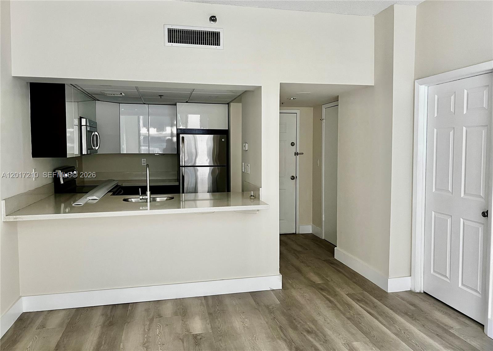 540 Brickell Key Drive, Unit 218 Miami, FL 33131 - Photo 3 of 12 a view of kitchen with stainless steel appliances granite countertop a refrigerator and a sink