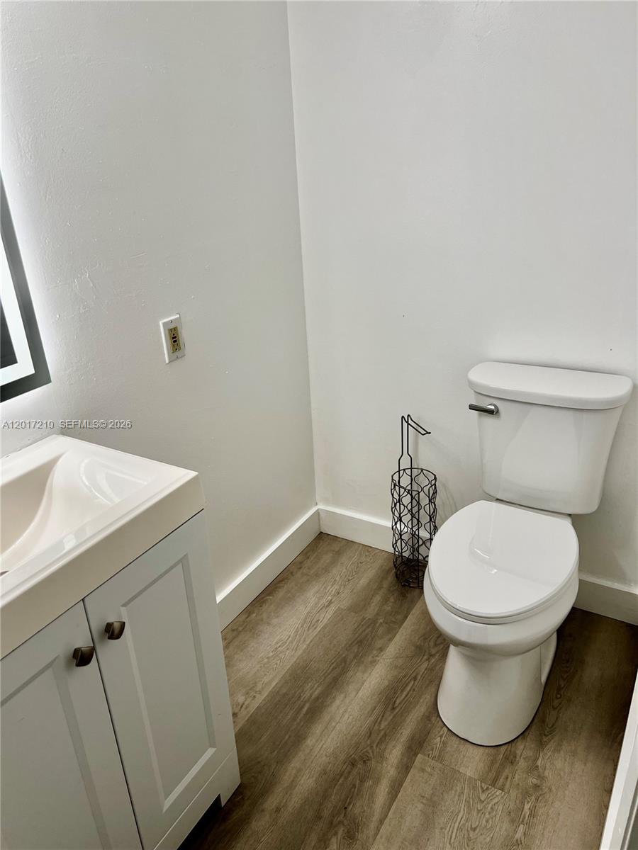 540 Brickell Key Drive, Unit 218 Miami, FL 33131 - Photo 7 of 12 a bathroom with a toilet and a sink