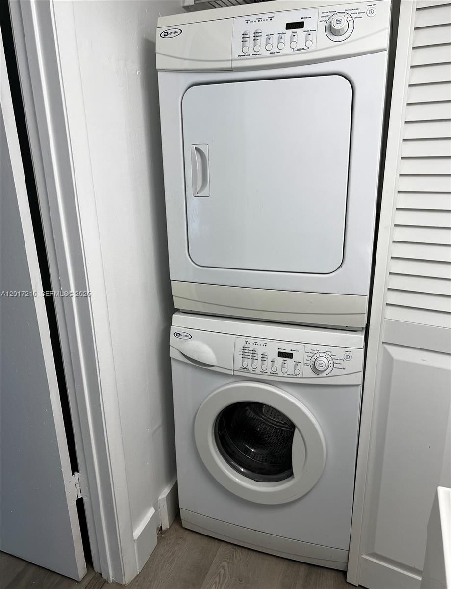 540 Brickell Key Drive, Unit 218 Miami, FL 33131 - Photo 9 of 12 a utility room with dryer and washer