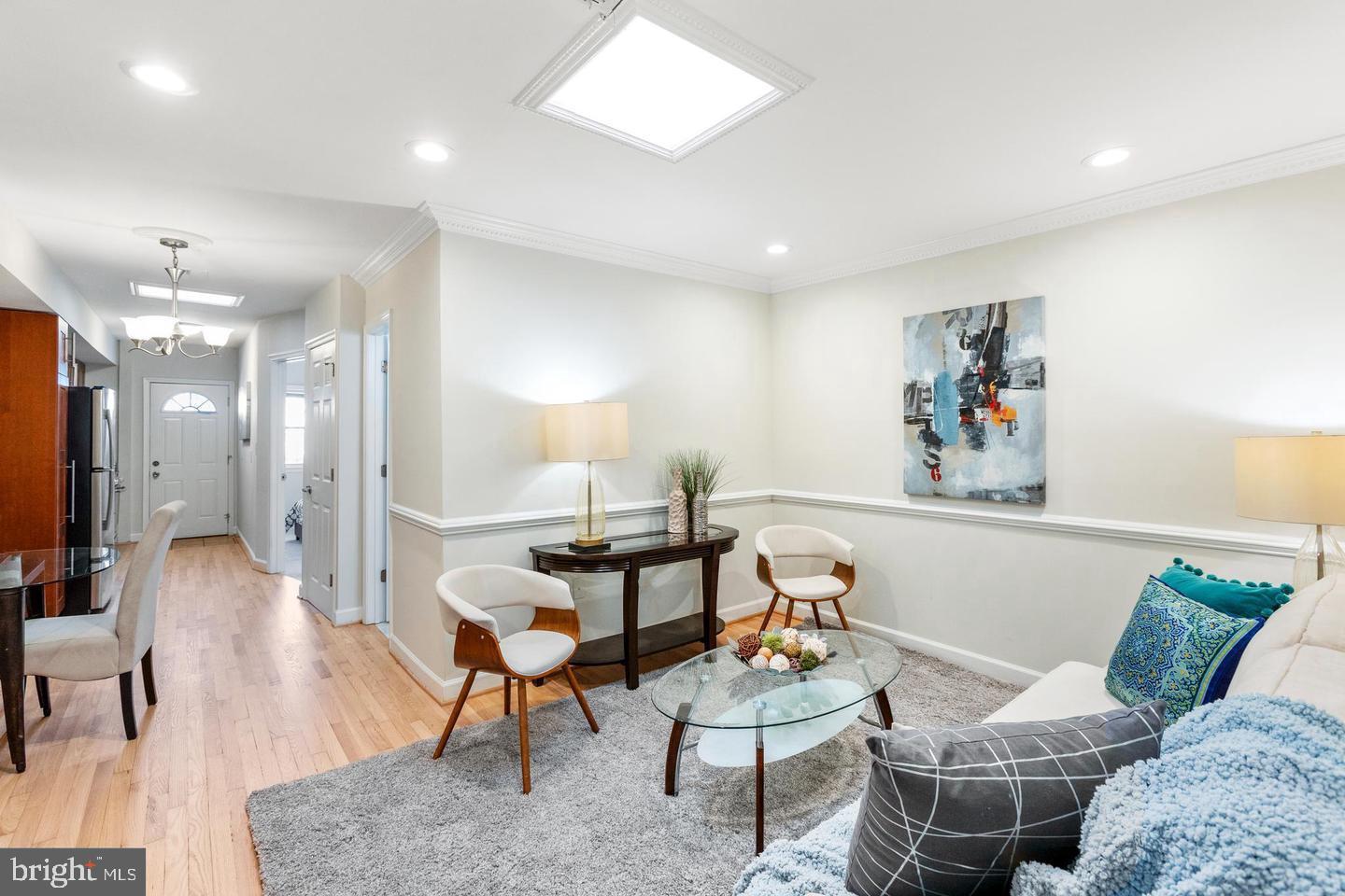 1229 18th Street Northeast, Unit 201 Washington, DC 20002 - Photo 3 of 14 a living room with furniture and a wooden floor