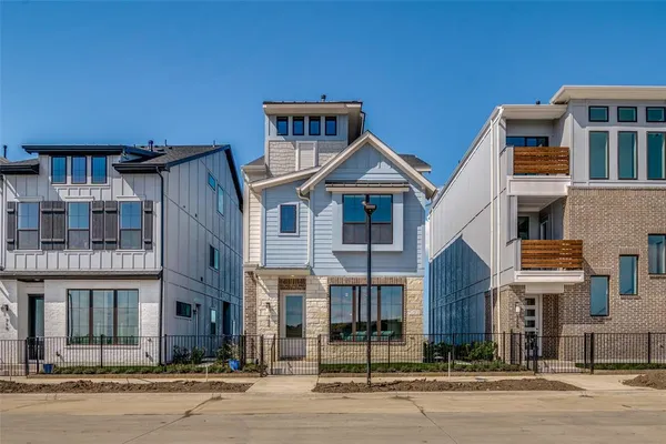 a front view of a residential apartment building with a street