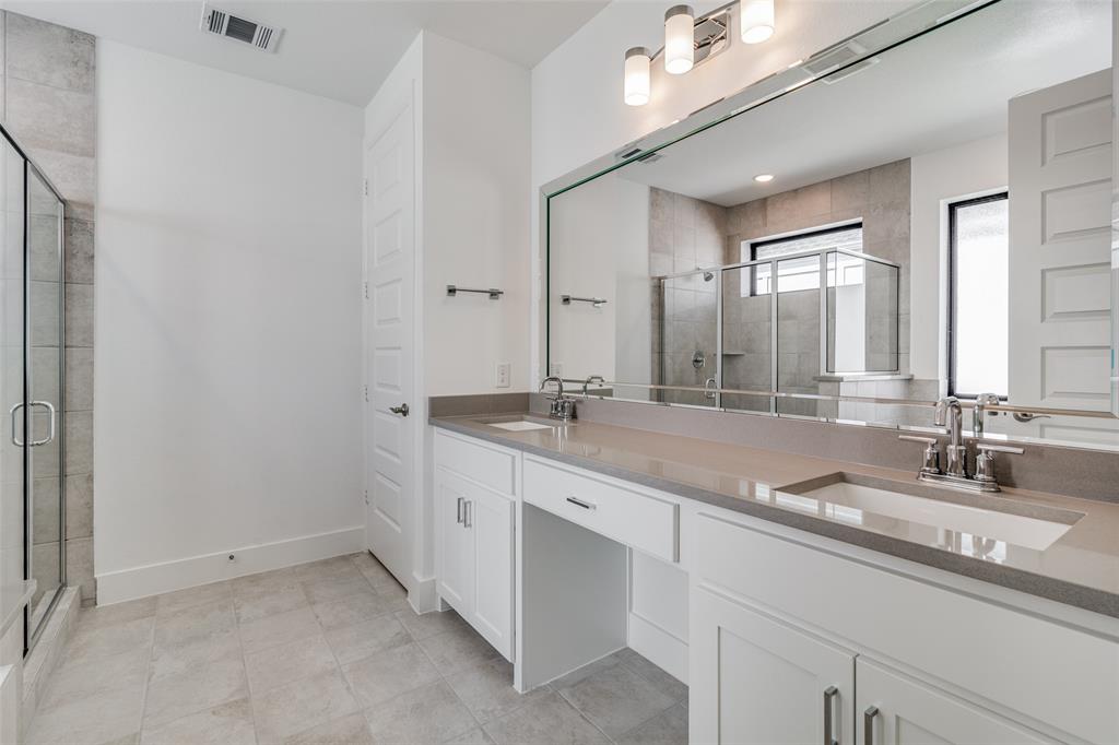 722 Resort Drive Rowlett, TX 75088 - Photo 12 of 24 a bathroom with a sink and a mirror