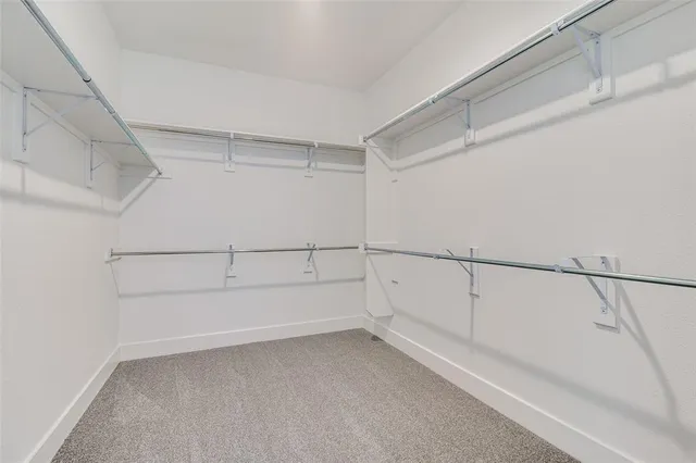 a view of an empty walk in closet
