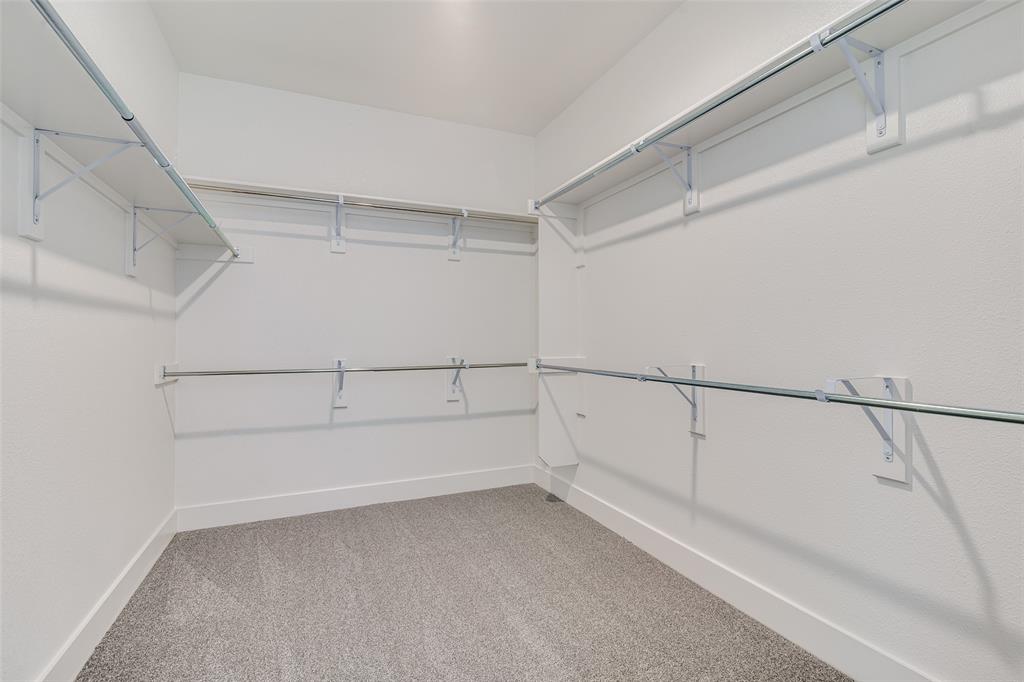 722 Resort Drive Rowlett, TX 75088 - Photo 14 of 24 a view of an empty walk in closet