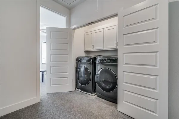 a view of a storage & utility room with washer and dryer