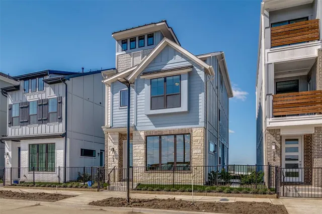 a front view of a house with a small yard
