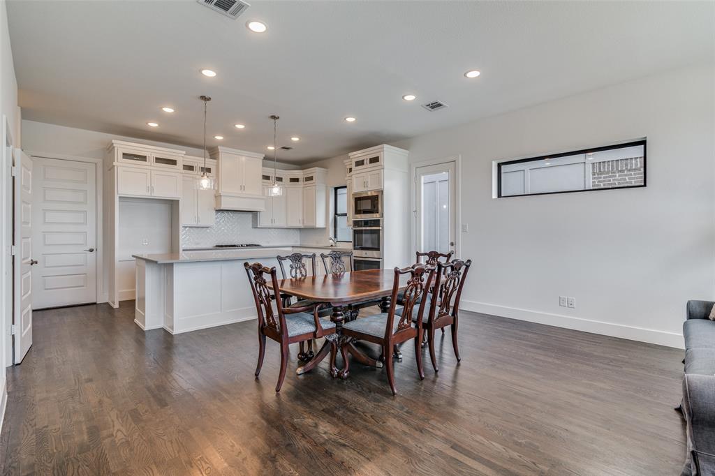 722 Resort Drive Rowlett, TX 75088 - Photo 5 of 24 a view of a dining room with furniture and wooden floor