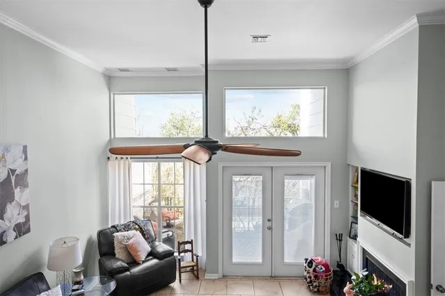 a kitchen with stainless steel appliances a sink and a chair