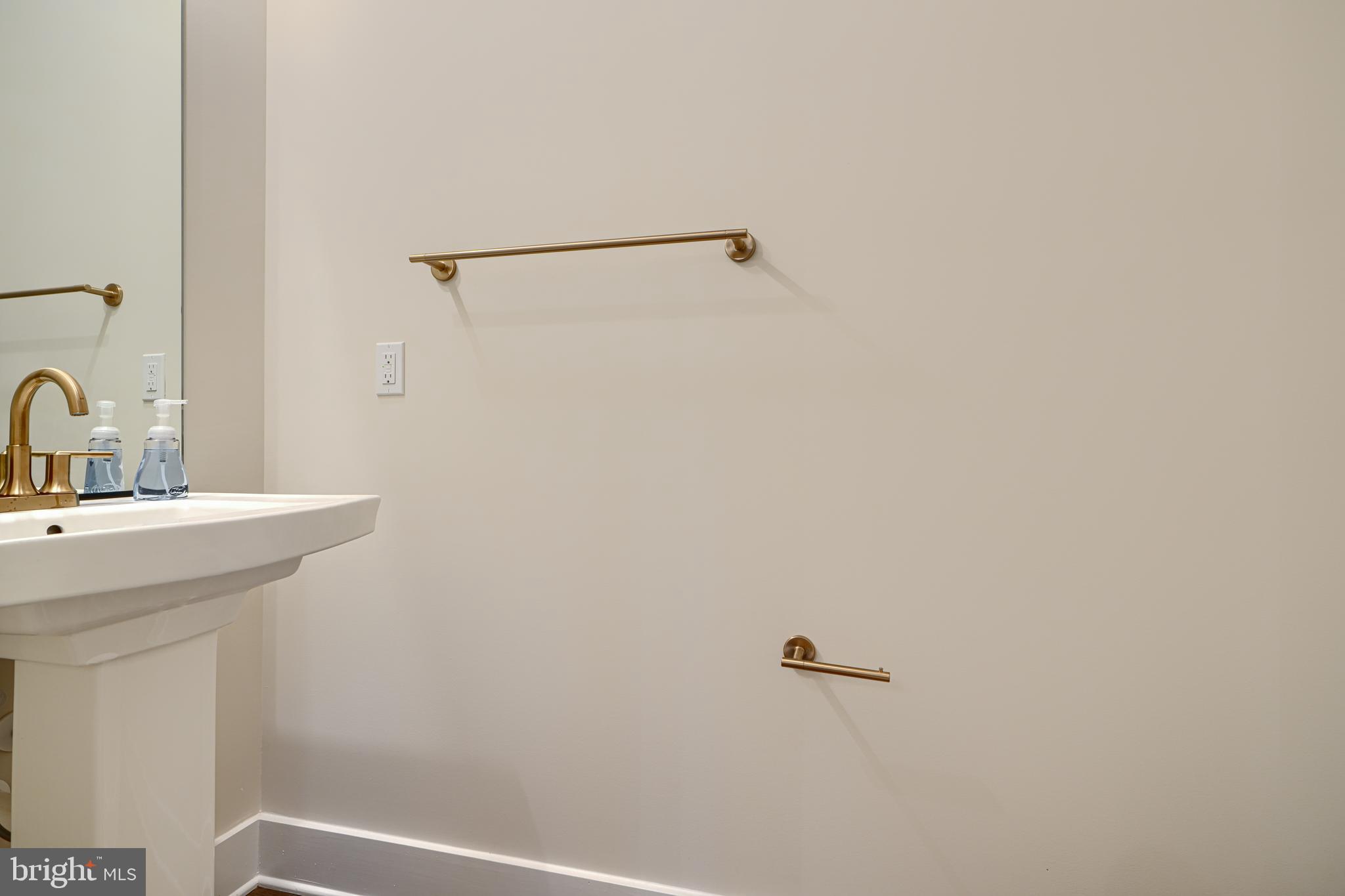 2603 Light Street Baltimore, MD 21230 - Photo 13 of 29 a bathroom with a sink and mirror