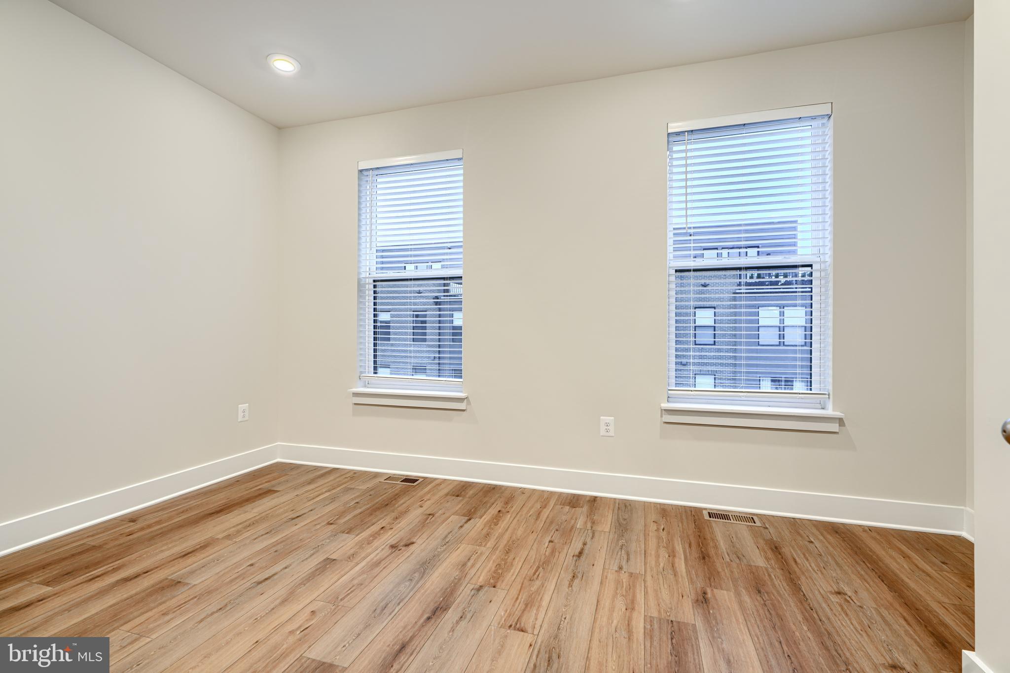 2603 Light Street Baltimore, MD 21230 - Photo 20 of 29 a view of an empty room with wooden floor and a window
