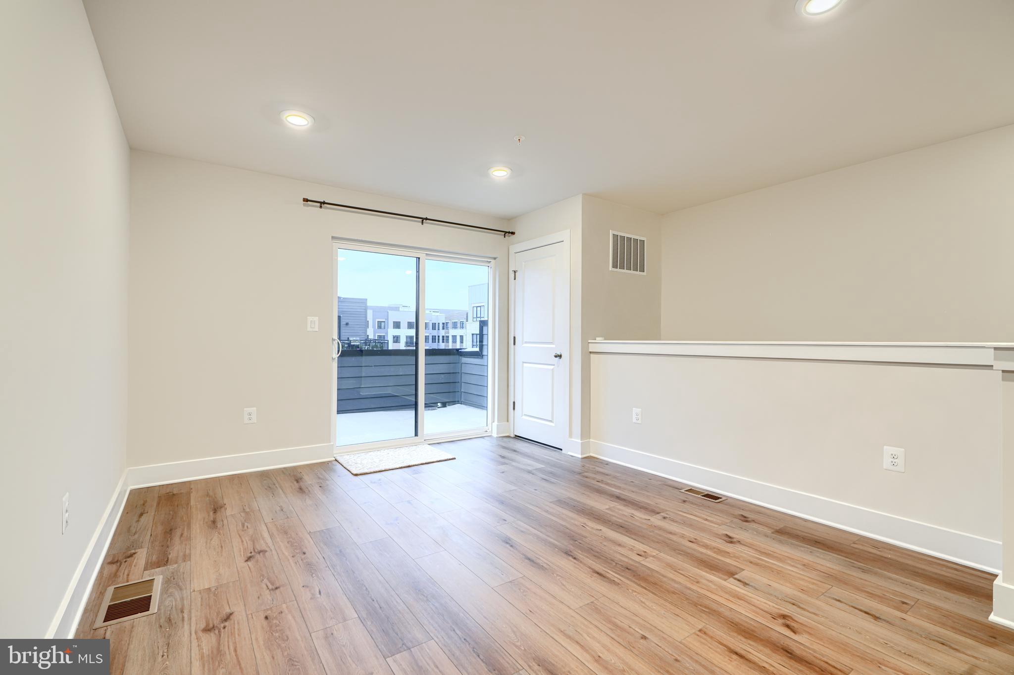2603 Light Street Baltimore, MD 21230 - Photo 27 of 29 wooden floor in an empty room with a window