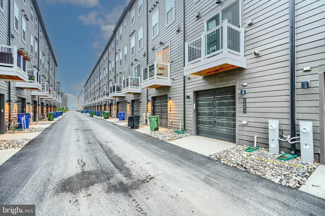 a view of a hallway with stairs and a window