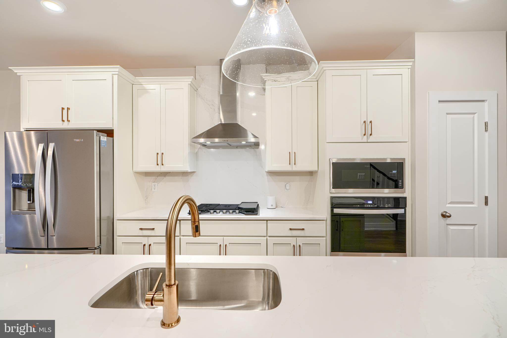 2603 Light Street Baltimore, MD 21230 - Photo 10 of 29 a kitchen with stainless steel appliances granite countertop a sink stove and refrigerator