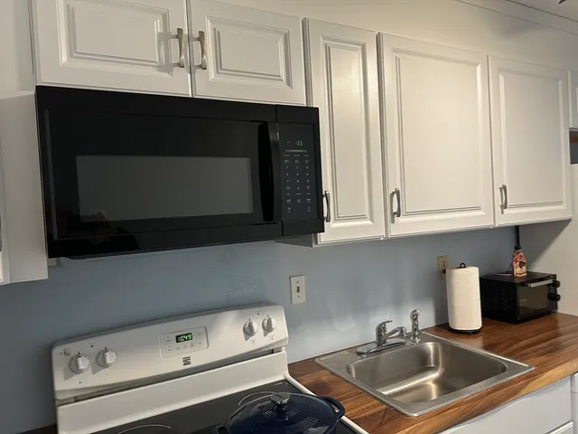 a kitchen with a stove and a microwave
