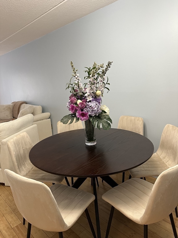 95 Nahant Street, Unit 12 Lynn, MA 01902 - Photo 10 of 28 a dining room with furniture and wooden floor