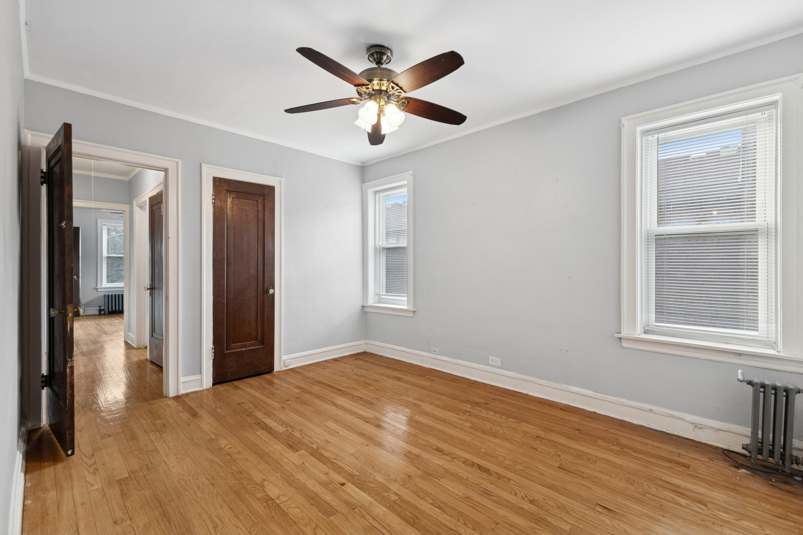 1311 West 91st Street Chicago, IL 60620 - Photo 9 of 19 a view of an empty room with wooden floor and a window