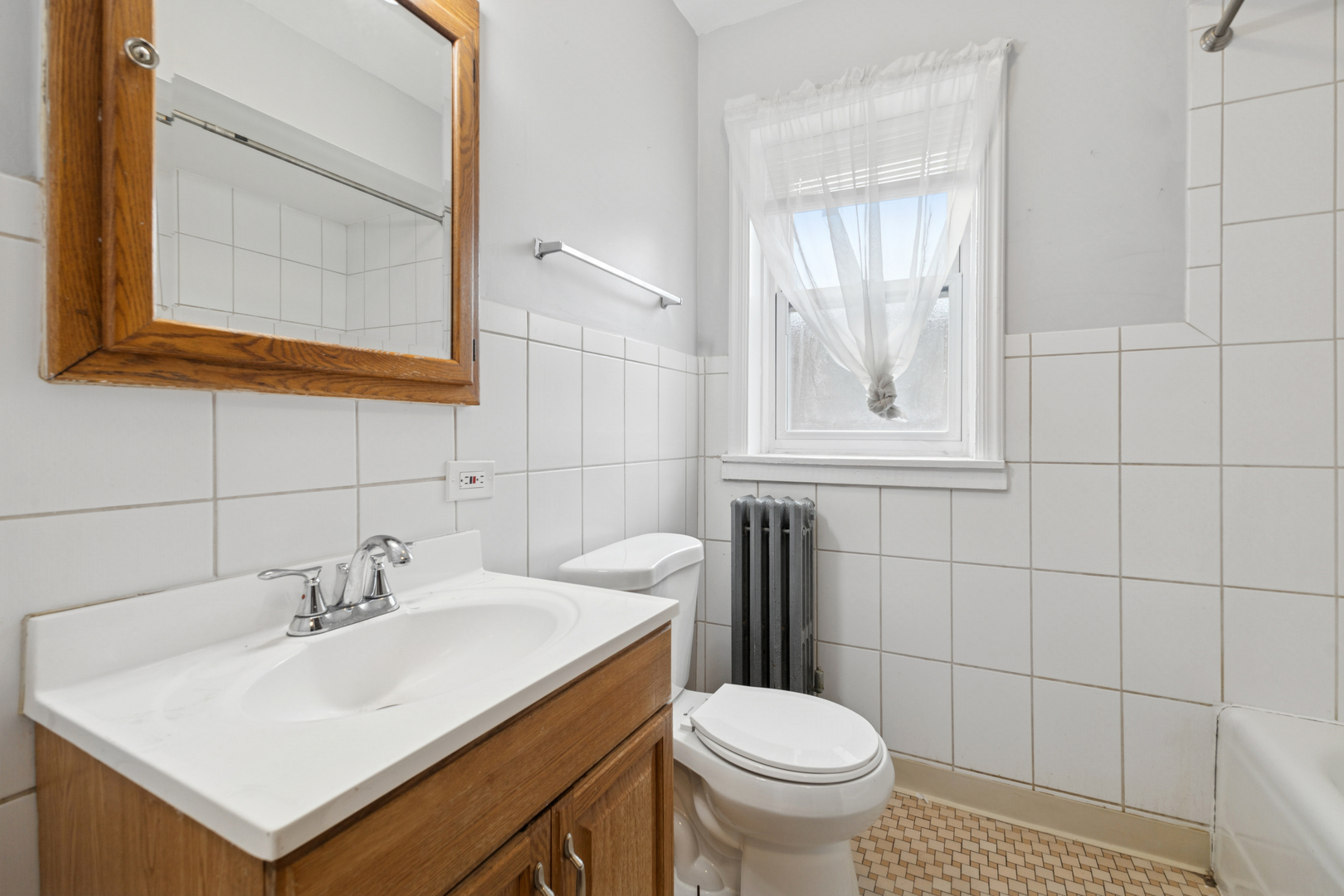 1311 West 91st Street Chicago, IL 60620 - Photo 10 of 19 a bathroom with a sink toilet and mirror