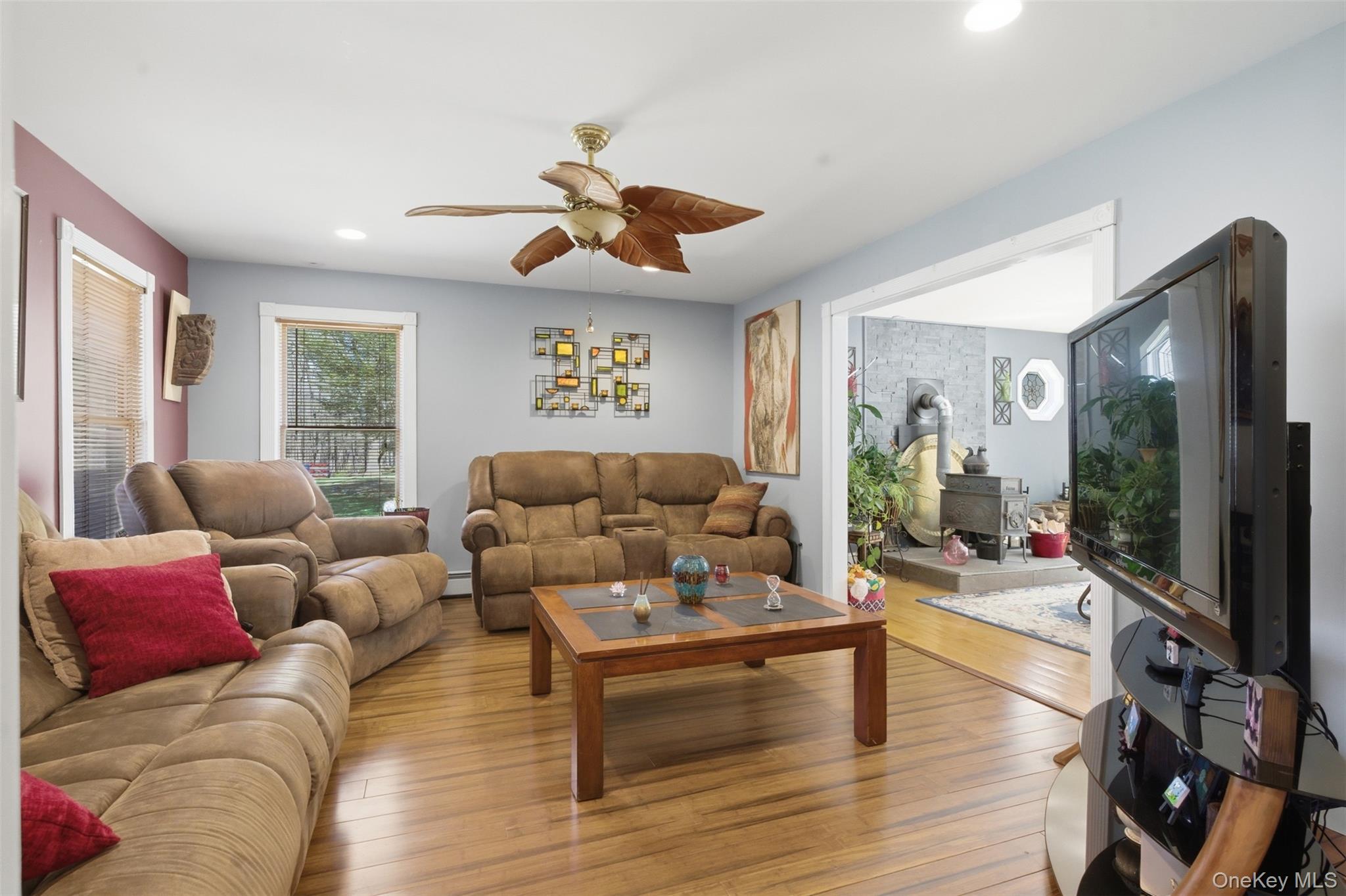 1285 Lakes Road Monroe, NY 10950 - Photo 15 of 45 a living room with furniture a flat screen tv and wooden floor