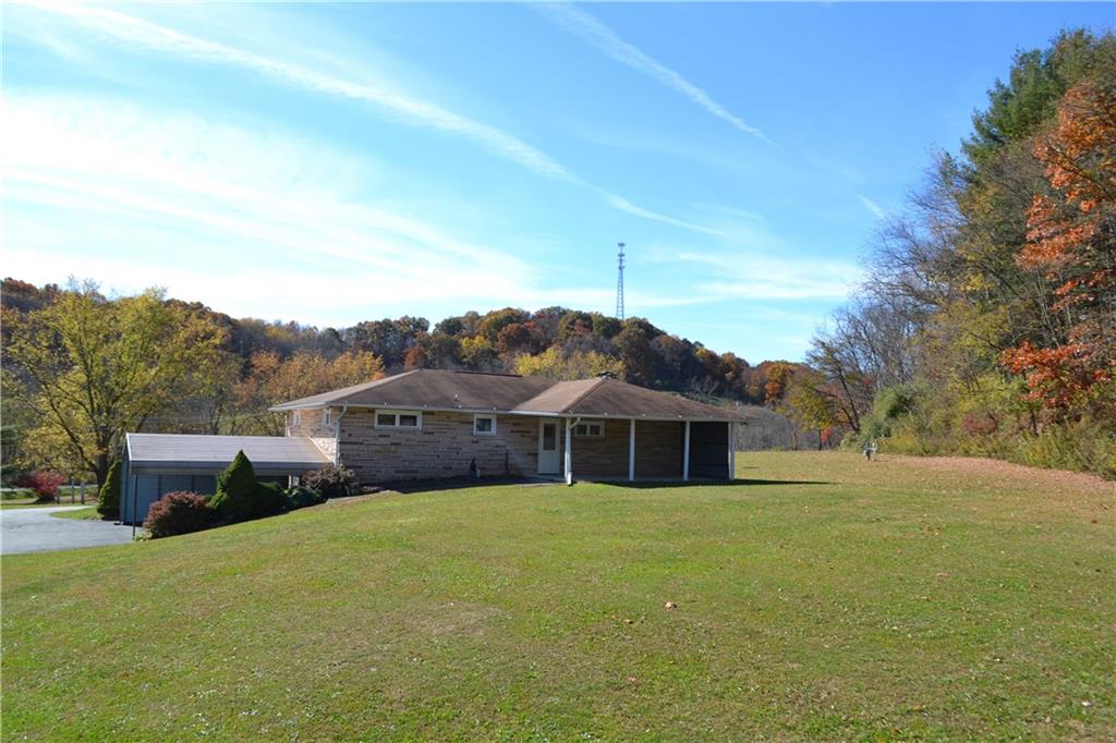 117 Creel Road Kittanning, PA 16201 - Photo 25 of 35 a front view of house with yard and trees in the background