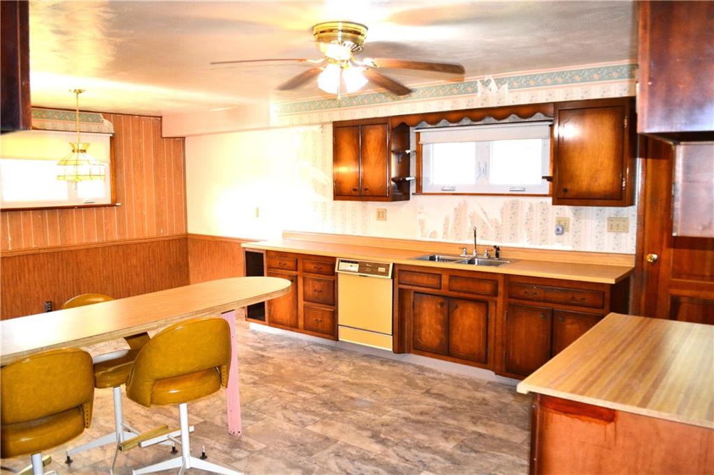 117 Creel Road Kittanning, PA 16201 - Photo 3 of 35 a kitchen with stainless steel appliances kitchen island granite countertop a sink and a refrigerator