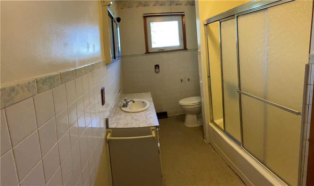 117 Creel Road Kittanning, PA 16201 - Photo 9 of 35 a bathroom with a granite countertop toilet and sink
