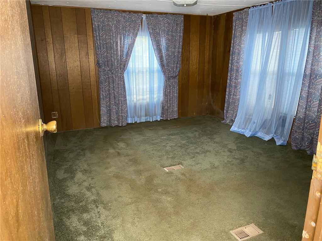 54899 Church Road Callahan, FL 32011 - Photo 15 of 35 a view of an empty room with wooden door