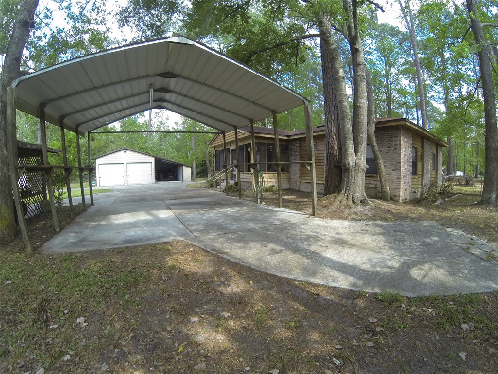 54899 Church Road Callahan, FL 32011 - Photo 21 of 35 a view of a wooden house with a yard