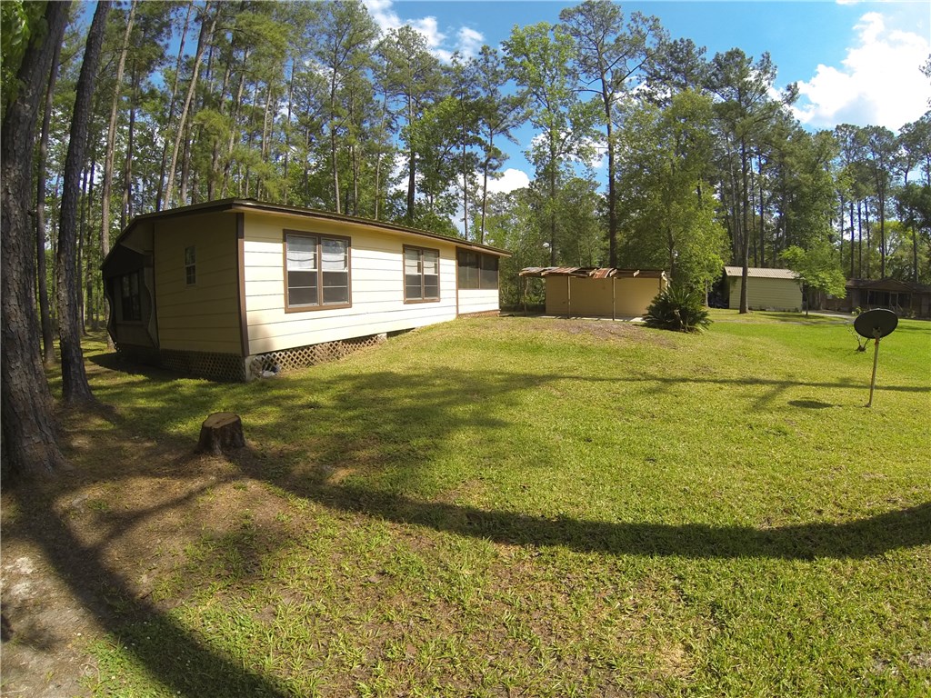 54899 Church Road Callahan, FL 32011 - Photo 32 of 35 a backyard of a house