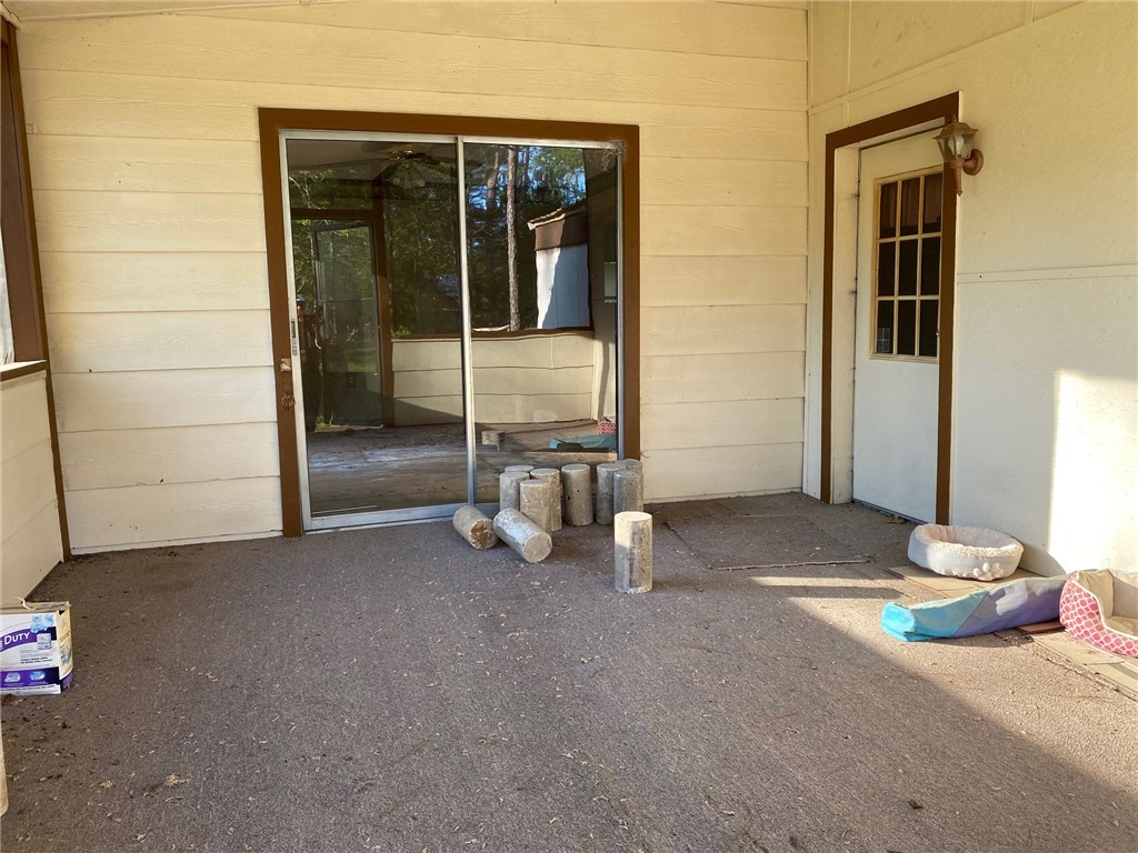 54899 Church Road Callahan, FL 32011 - Photo 33 of 35 a view of a room with wooden floor and windows