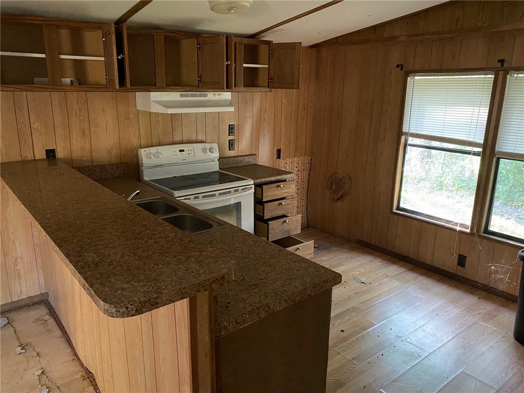 54899 Church Road Callahan, FL 32011 - Photo 35 of 35 a kitchen with stainless steel appliances granite countertop a sink stove and refrigerator