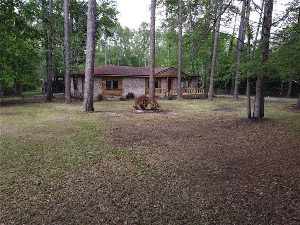 54899 Church Road Callahan, FL 32011 - Photo 5 of 35 a view of a house with backyard